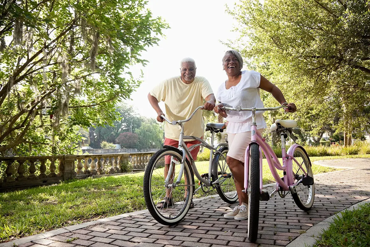 Seniors with their bicycles Seniors with their bicycles