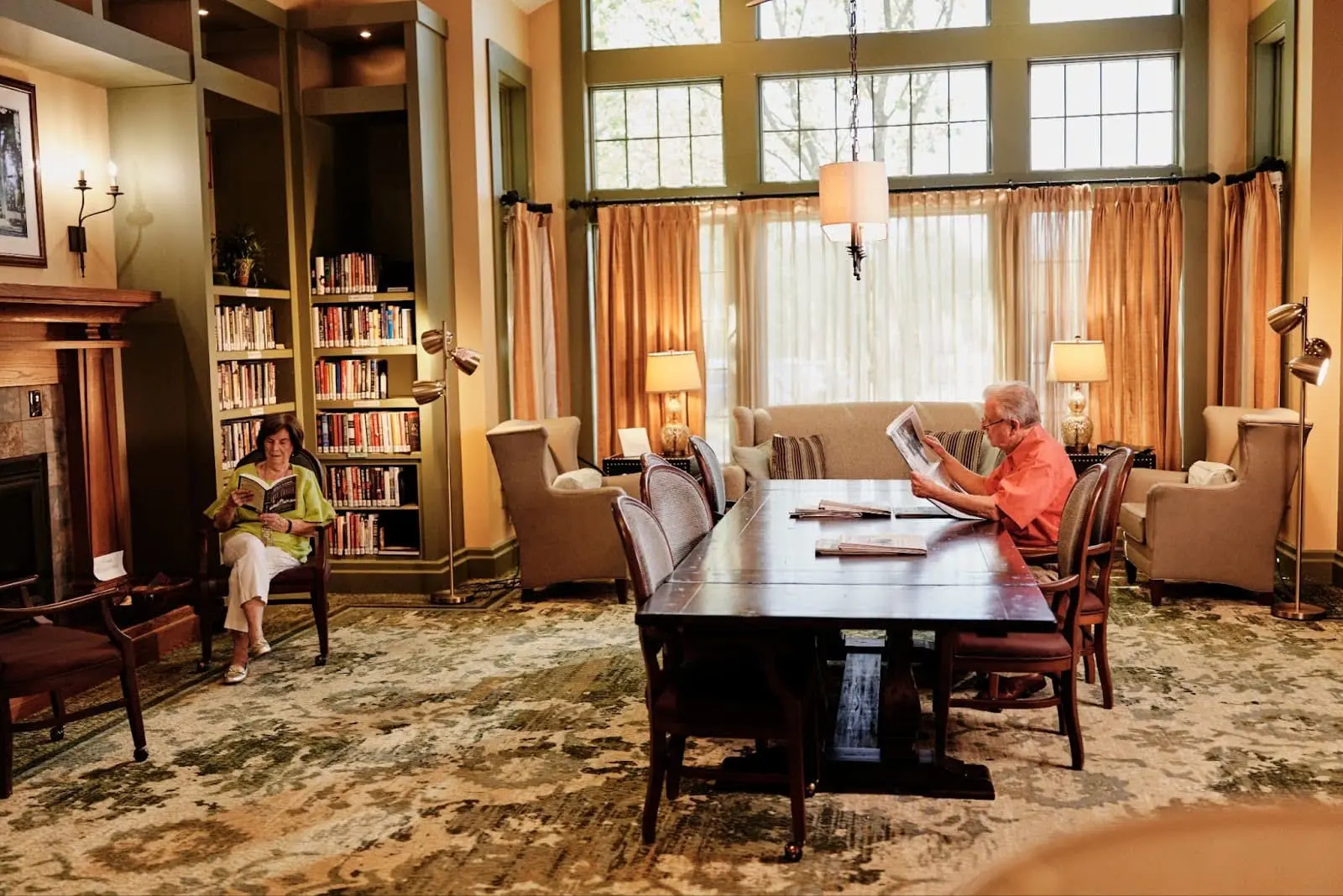 Seniors enjoying a book in the library Seniors enjoying a book in the library