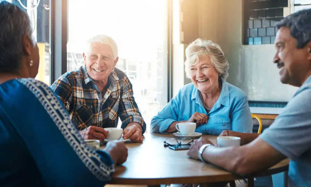 Seniors sitting and drinking coffee
