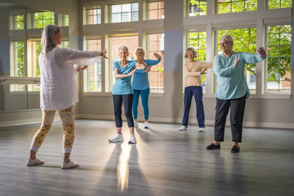 A group of 5 elderly women in a senior exercise class at The Heritage at Brentwood in TN.