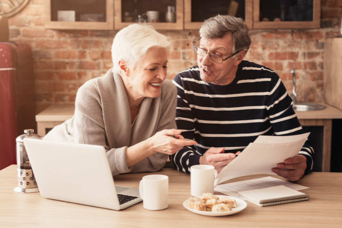 Elderly couple reading together
