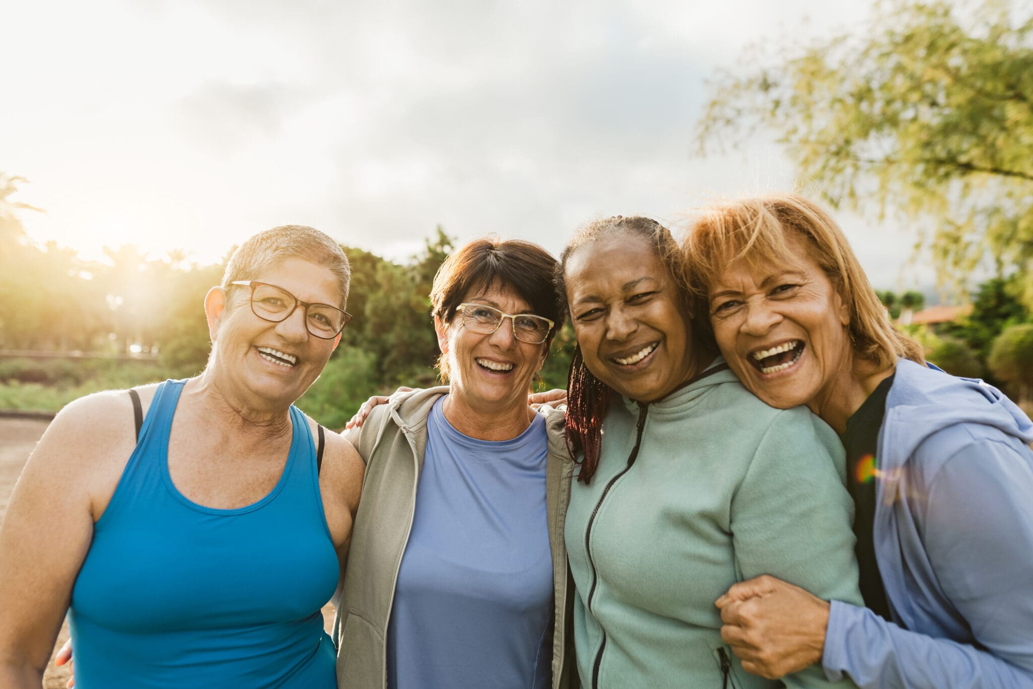 Active senior women outside smiling