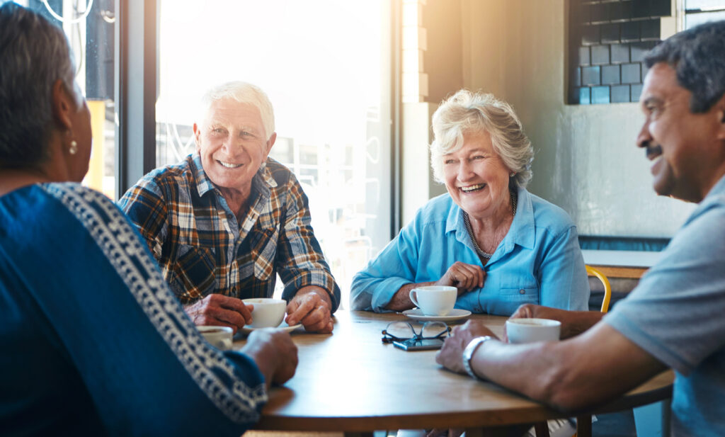 Seniors sitting and drinking coffee