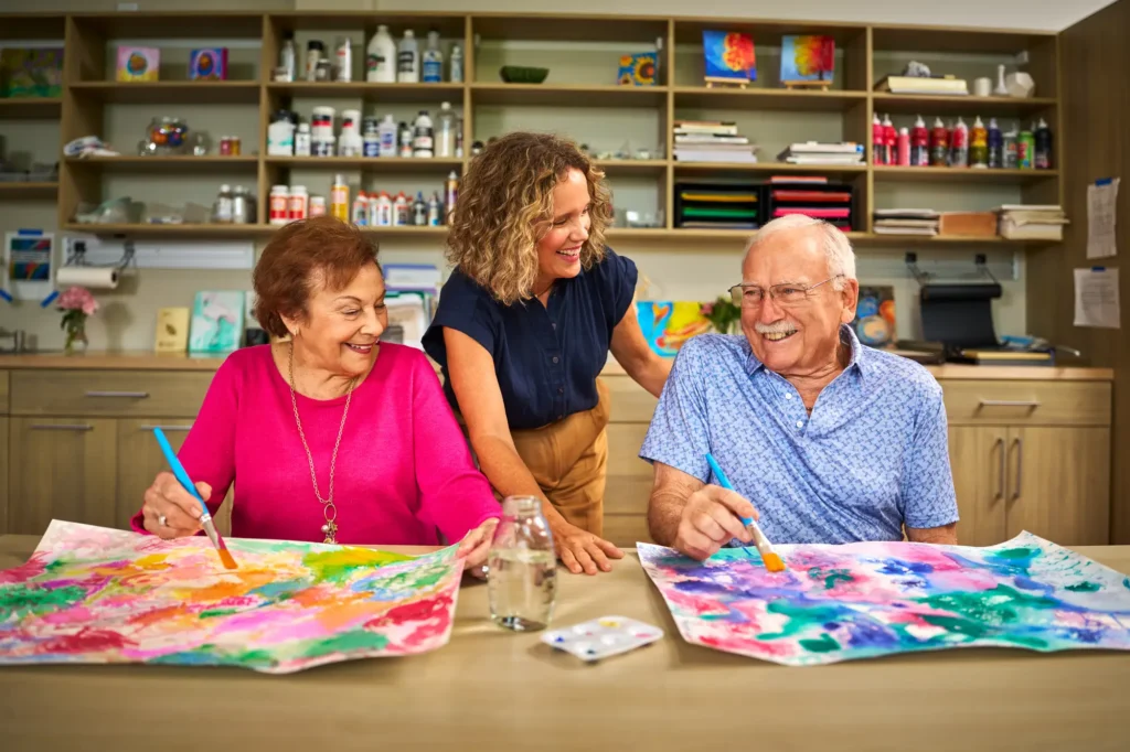 seniors painting at the community