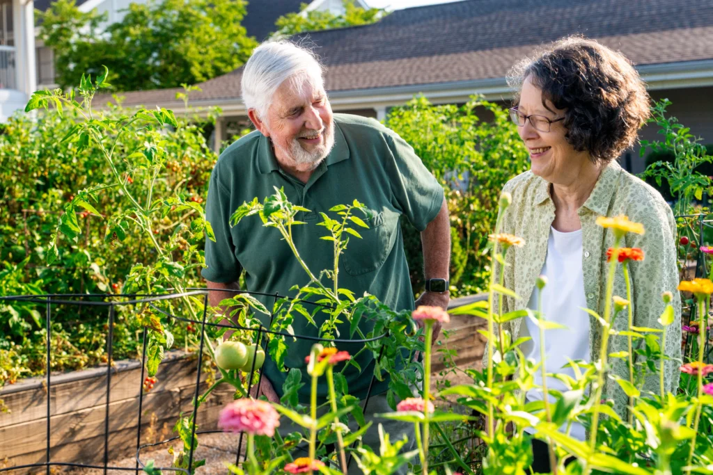 Heritage residents with Type A CCRC contract types in raised garden.