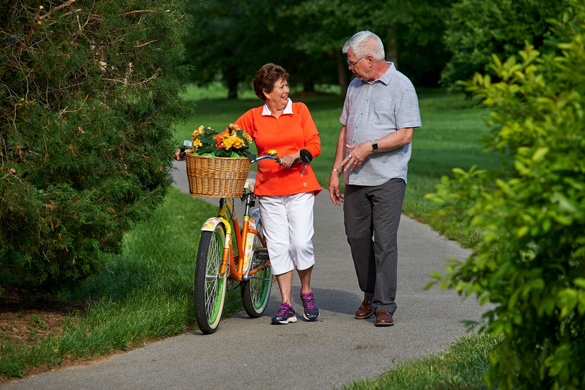 Senior couple on a walk outside their retirement community