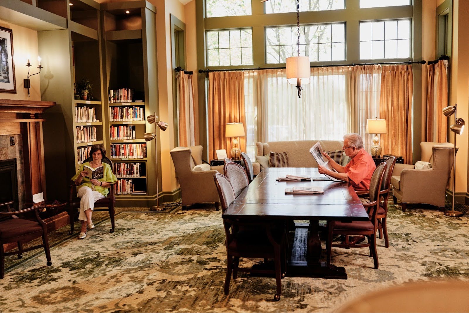 Seniors enjoying a book in the library